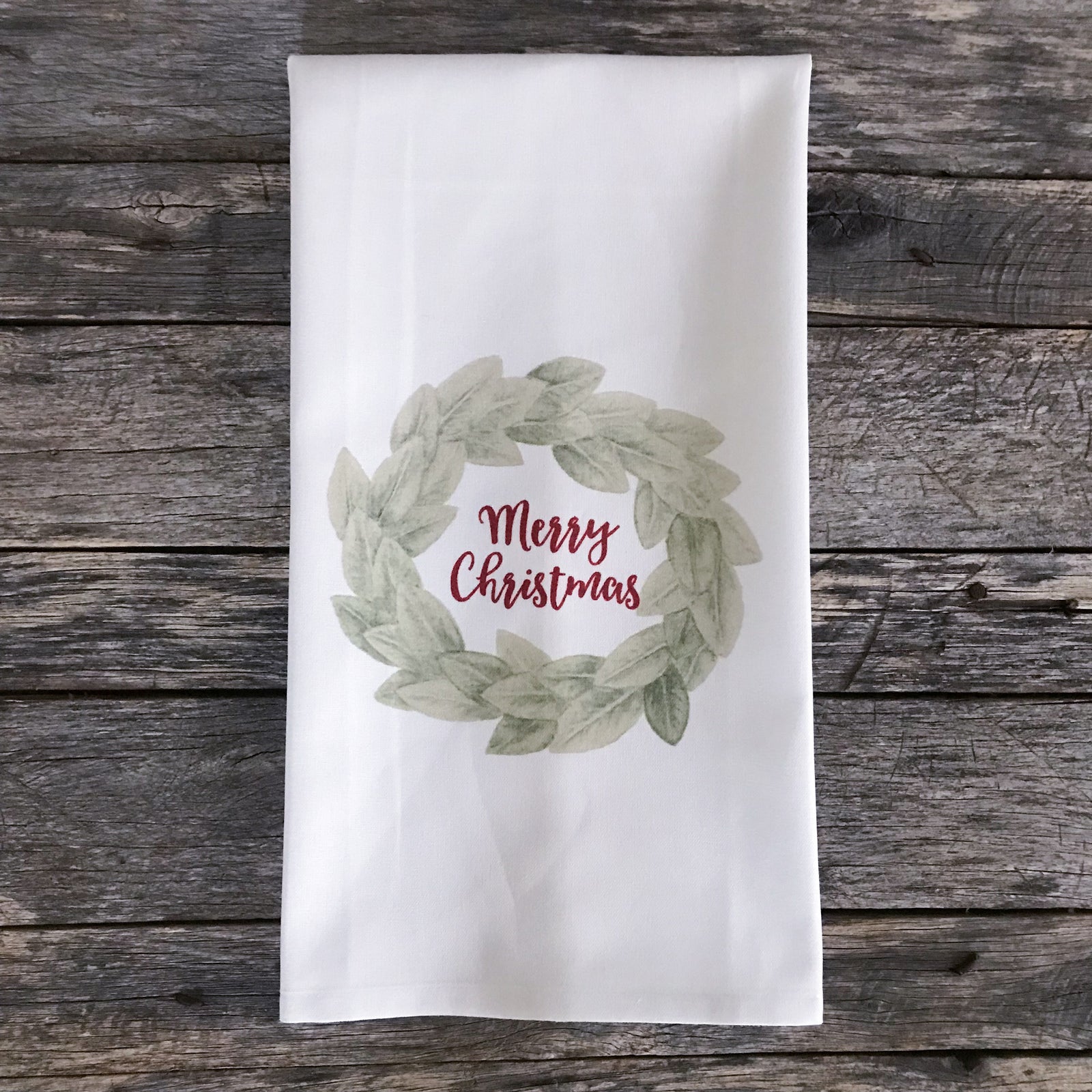 https://www.linenandivory.com/cdn/shop/products/Magnolia_Merry_Christmas_Wreath_Farmhouse_Vintage_Decor_Kitchen_Tea_Towel_1600x.jpg?v=1584217988
